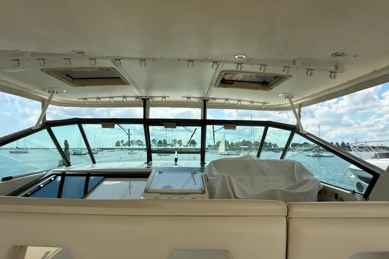  Yacht Photos Pics Interior view of 1994 Tiara Yachts 4000 Express, overlooking marina with sailboats.