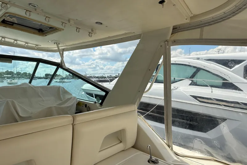  Yacht Photos Pics Interior view of a 1994 Tiara Yachts 4000 Express, overlooking marina with boats.