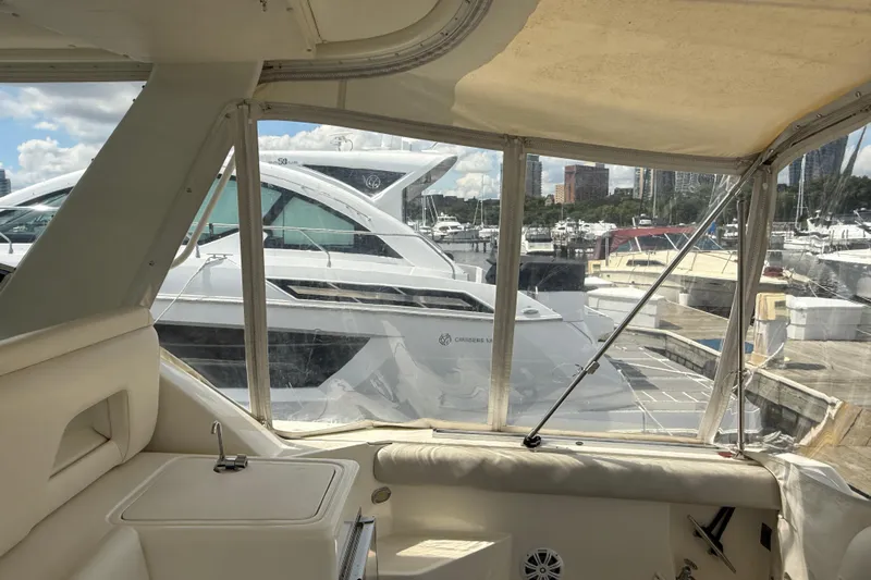  Yacht Photos Pics Interior view of a 1994 Tiara Yachts 4000 Express, overlooking a marina.