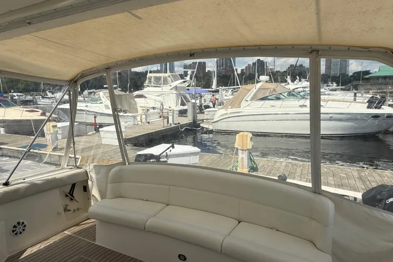  Yacht Photos Pics 1994 Tiara Yachts 4000 Express interior view at marina, showcasing docked boats.