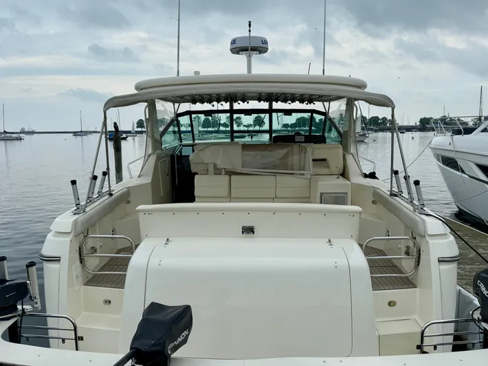  Yacht Photos Pics 2004 Tiara Yachts 4000 Express docked at a marina, rear view.