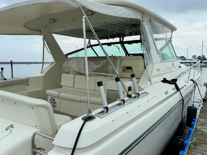  Yacht Photos Pics 2004 Tiara Yachts 4000 Express docked, showcasing spacious seating and sleek design.