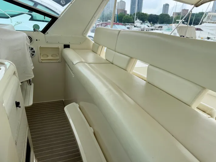  Yacht Photos Pics Interior of 2004 Tiara Yachts 4000 Express with cream seating and harbor view.