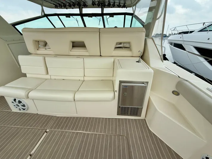  Yacht Photos Pics 2004 Tiara Yachts 4000 Express interior with beige seating and mini fridge.