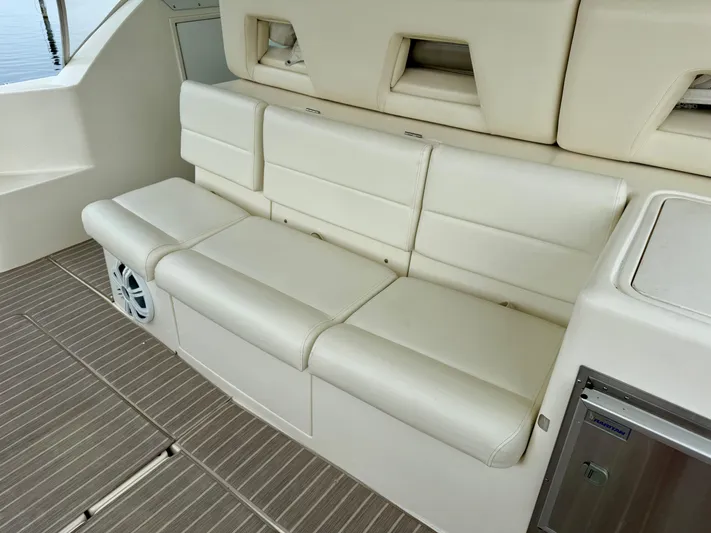  Yacht Photos Pics 2004 Tiara Yachts 4000 Express interior with white leather seating and wood flooring.