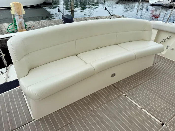  Yacht Photos Pics White leather seating on 2004 Tiara Yachts 4000 Express, docked by the water.