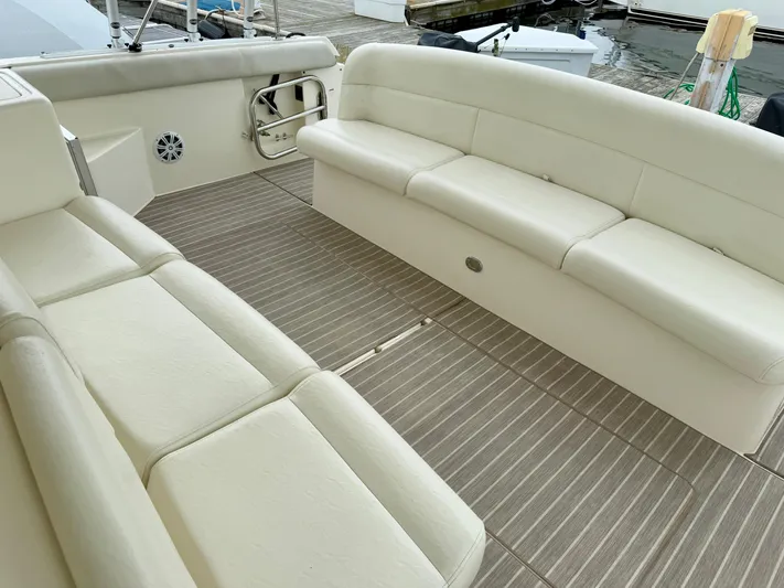  Yacht Photos Pics 2004 Tiara Yachts 4000 Express interior with beige seating and striped flooring.