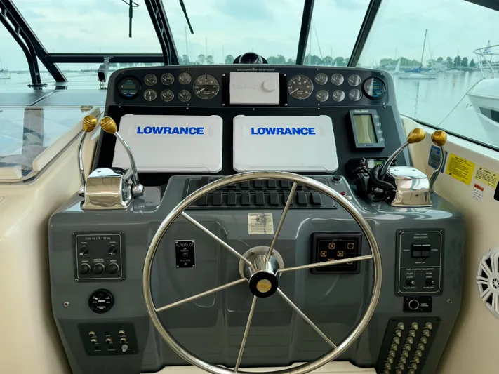  Yacht Photos Pics Helm of 2004 Tiara Yachts 4000 Express with Lowrance navigation system and dual throttle controls.