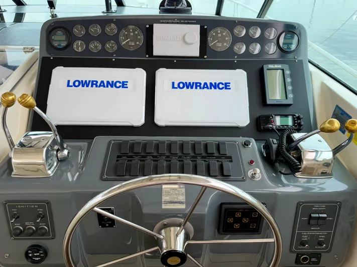  Yacht Photos Pics 2004 Tiara Yachts 4000 Express helm with Lowrance displays and navigation controls.