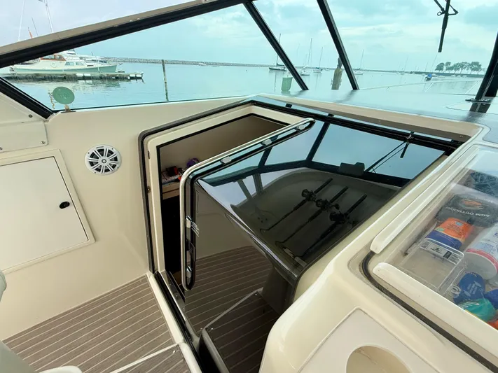  Yacht Photos Pics 2004 Tiara Yachts 4000 Express interior with open cabin door and marina view.