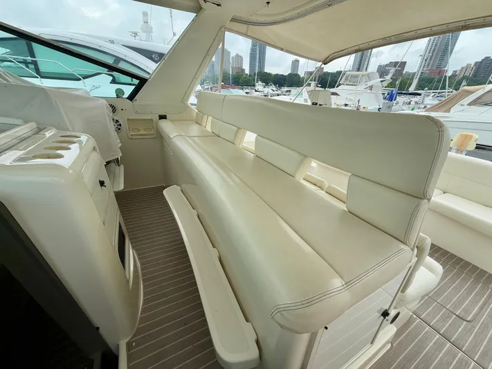  Yacht Photos Pics 2004 Tiara Yachts 4000 Express interior with white seating and marina view.