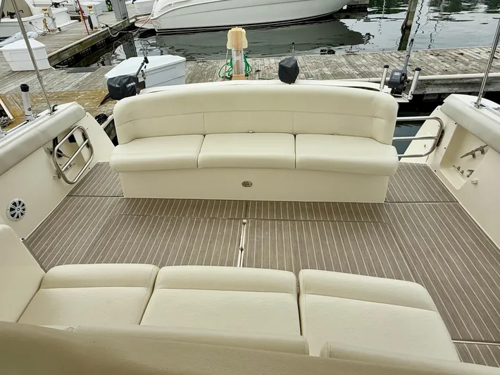 Yacht Photos Pics 2004 Tiara Yachts 4000 Express boat interior with beige seating and striped flooring.
