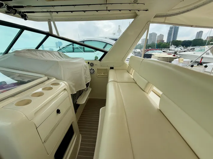  Yacht Photos Pics 2004 Tiara Yachts 4000 Express interior with seating and helm, docked in marina.