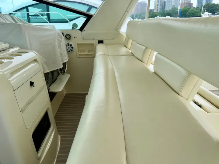  Yacht Photos Pics 2004 Tiara Yachts 4000 Express interior with cream leather seating and helm area.