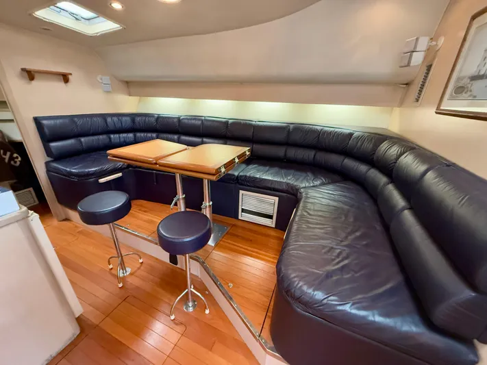  Yacht Photos Pics Luxurious 2004 Tiara Yachts 4000 Express interior with leather seating and wooden flooring.