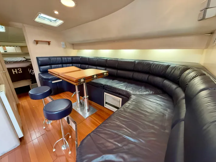 Yacht Photos Pics Luxurious interior of 2004 Tiara Yachts 4000 Express with leather seating and wooden flooring.