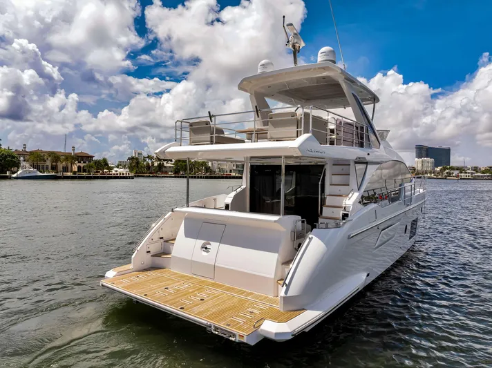  Yacht Photos Pics 2022 Azimut Fly 60 yacht on water, showcasing luxury design and spacious deck.