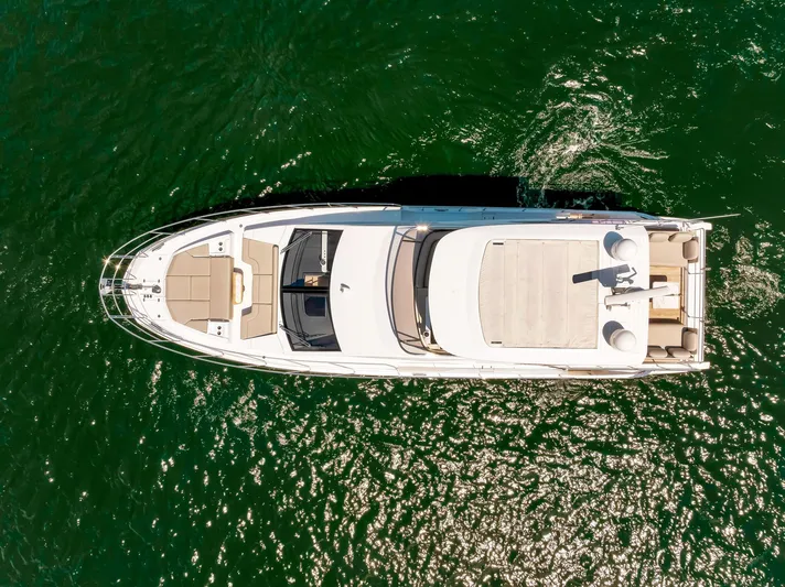  Yacht Photos Pics Aerial view of 2022 Azimut Fly 60 yacht on green water.