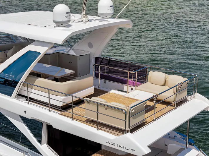  Yacht Photos Pics Luxurious 2022 Azimut Fly 60 yacht with spacious upper deck and elegant seating.