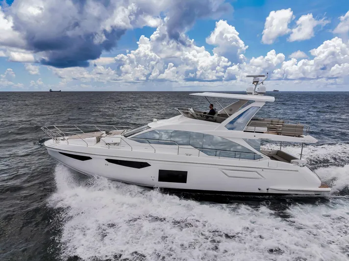  Yacht Photos Pics Azimut Fly 60 yacht cruising on the ocean under a cloudy sky, 2022 model.