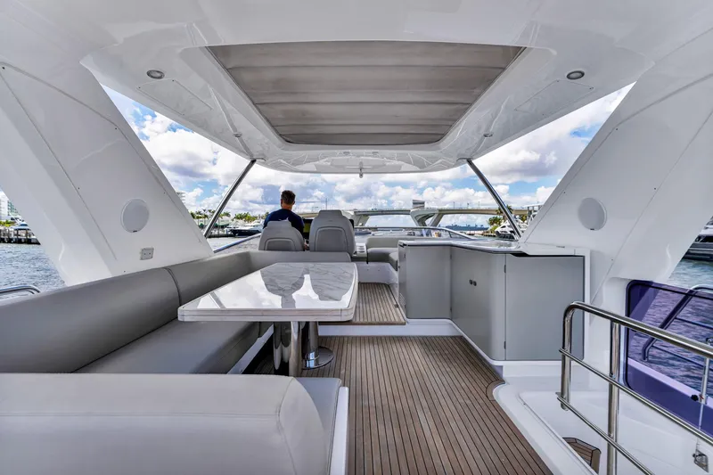  Yacht Photos Pics Luxurious 2022 Azimut Fly 60 yacht interior with elegant seating and scenic water views.