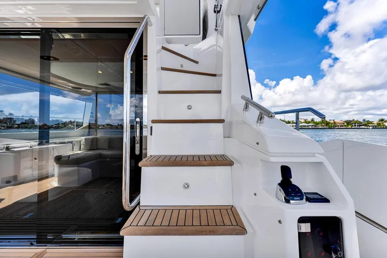  Yacht Photos Pics Azimut Fly 60 yacht, 2022 model, featuring elegant stairs and luxurious interior with ocean view.