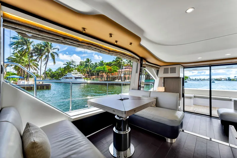  Yacht Photos Pics Luxurious interior of 2022 Azimut Fly 60 yacht with waterfront view and modern seating.