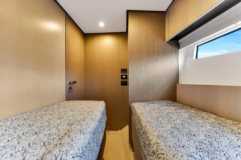  Yacht Photos Pics Twin cabin interior of 2022 Azimut Fly 60 yacht, featuring modern design and window view.