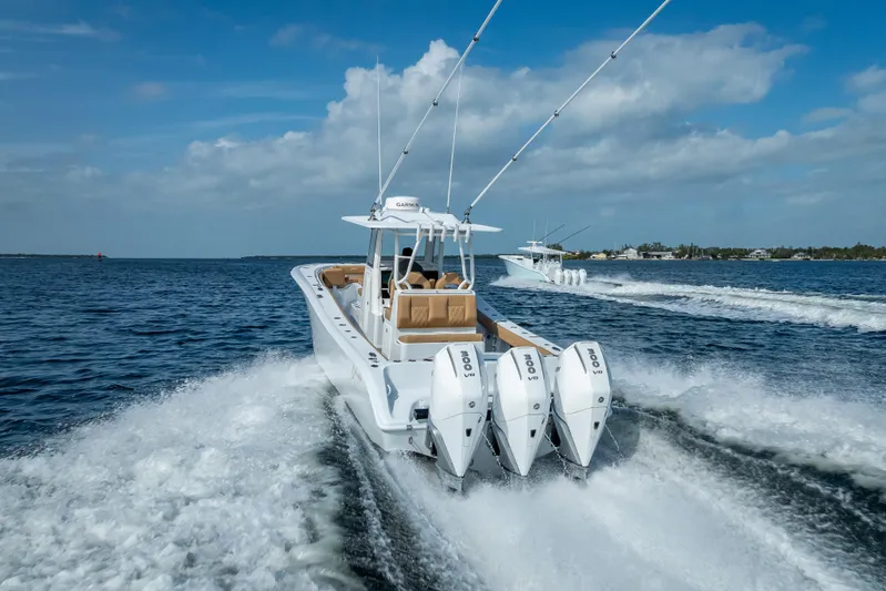 New Stock 42 Offshore Yacht Photos Pics 2026 Yellowfin 42 Offshore boat cruising on open water, showcasing powerful engines.