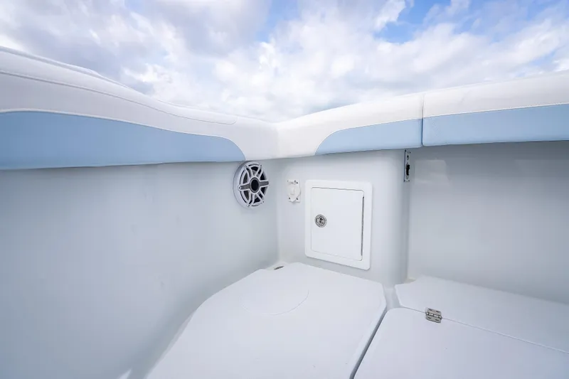 New Stock 42 Offshore Yacht Photos Pics 2026 Yellowfin 42 Offshore boat interior with speaker and storage compartment.