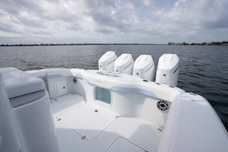 New Stock 42 Offshore Yacht Photos Pics 2026 Yellowfin 42 Offshore boat with Mercury engines on calm water.