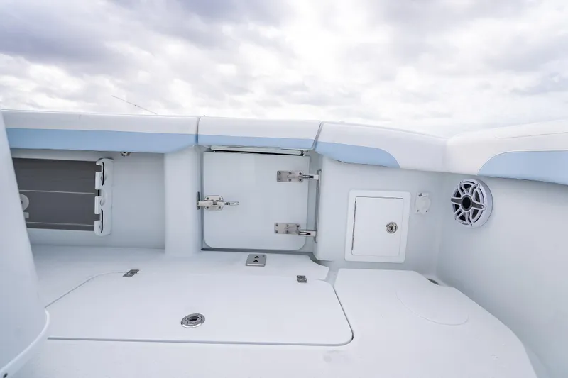 New Stock 42 Offshore Yacht Photos Pics 2026 Yellowfin 42 Offshore boat interior with storage compartments and speaker.