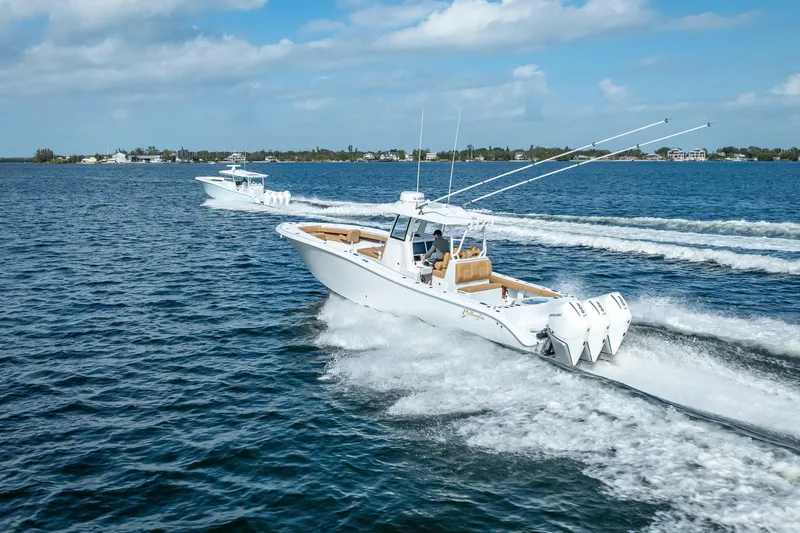 New Stock 42 Offshore Yacht Photos Pics 2026 Yellowfin 42 Offshore boat cruising on open water, showcasing powerful engines.