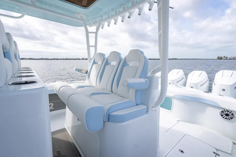 New Stock 42 Offshore Yacht Photos Pics 2026 Yellowfin 42 Offshore boat interior with luxurious seating and multiple outboard engines.