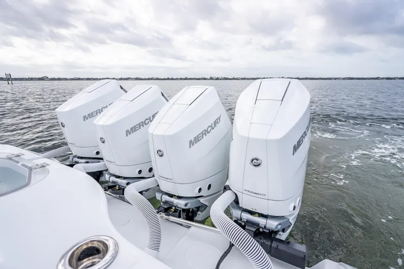 New Stock 42 Offshore Yacht Photos Pics Four Mercury Verado engines on a 2026 Yellowfin 42 Offshore boat in open water.