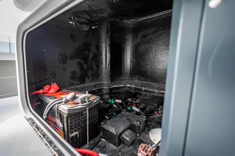New Stock 42 Offshore Yacht Photos Pics Battery compartment of 2026 Yellowfin 42 Offshore boat, showcasing electrical components.