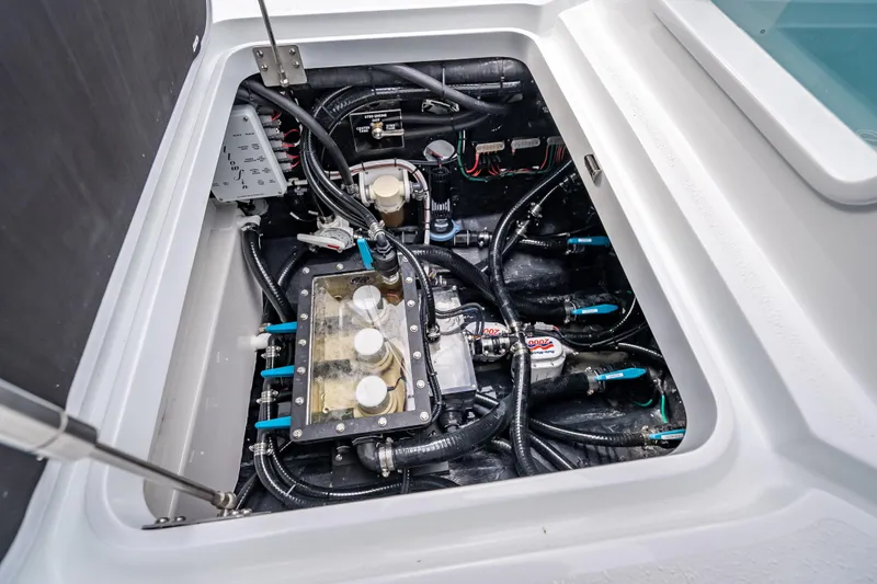 New Stock 42 Offshore Yacht Photos Pics Engine compartment of 2026 Yellowfin 42 Offshore boat, showcasing intricate wiring and components.