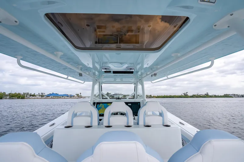 New Stock 42 Offshore Yacht Photos Pics 2026 Yellowfin 42 Offshore boat interior with modern seating and navigation system.