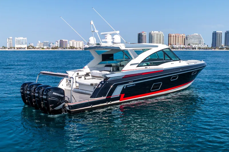  Yacht Photos Pics 2017 Formula 430 All Sport Crossover yacht on water, city skyline in background.