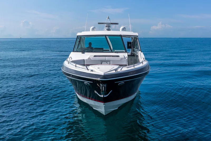  Yacht Photos Pics 2017 Formula 430 All Sport Crossover boat on calm blue ocean waters.