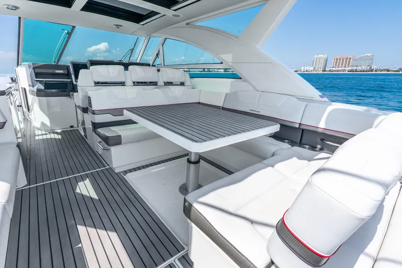  Yacht Photos Pics 2017 Formula 430 All Sport Crossover yacht interior with seating and table, overlooking ocean view.