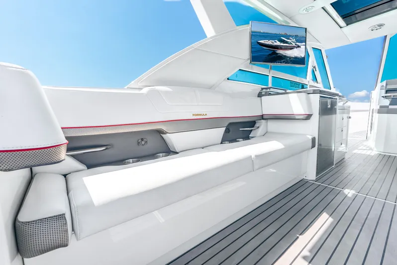  Yacht Photos Pics 2017 Formula 430 All Sport Crossover interior with white seating and mounted TV.