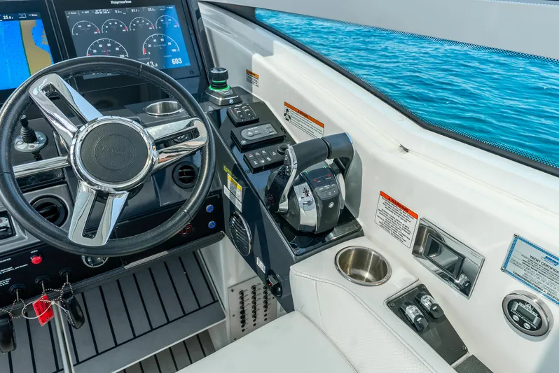  Yacht Photos Pics 2017 Formula 430 All Sport Crossover boat cockpit with steering wheel and control panel.