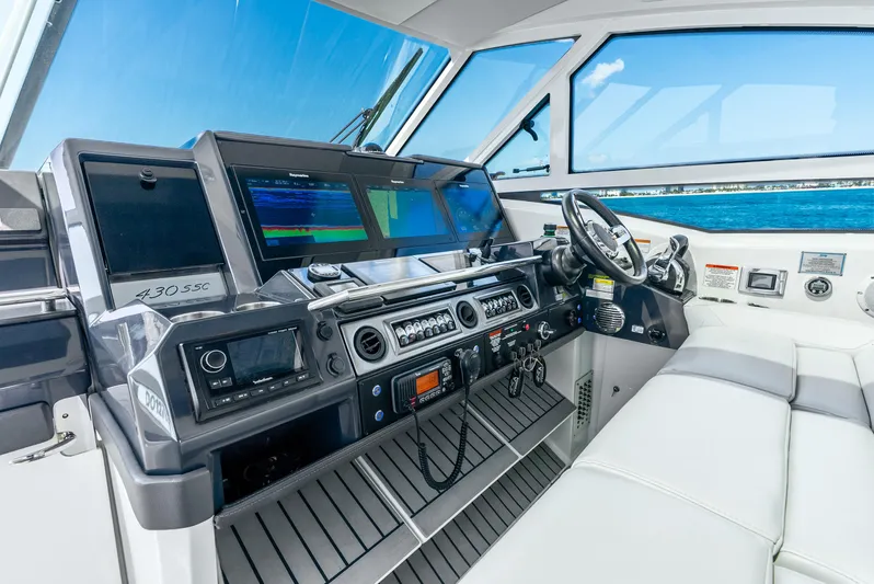 Yacht Photos Pics 2017 Formula 430 All Sport Crossover boat cockpit with advanced navigation systems and luxurious seating.