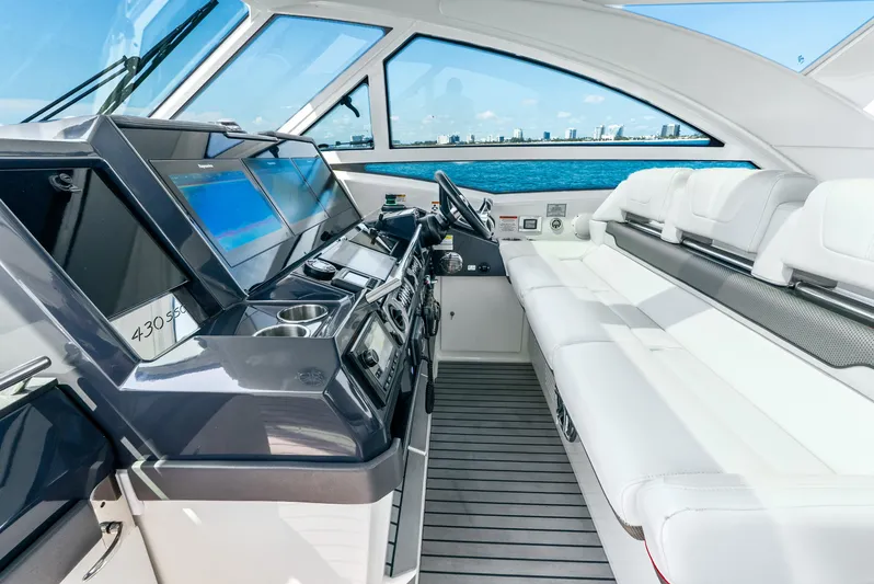  Yacht Photos Pics 2017 Formula 430 All Sport Crossover boat interior with modern dashboard and white seating.