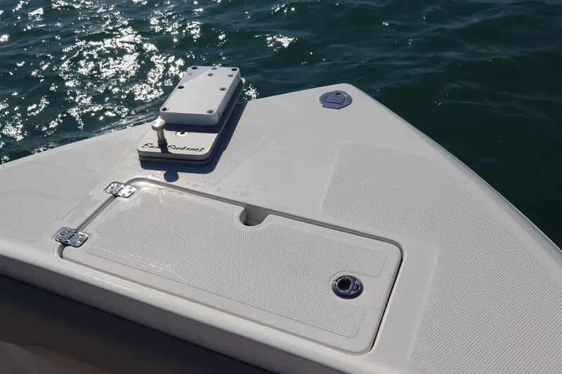  Yacht Photos Pics Bow of 2017 Sailfish 320 CC boat with anchor hatch, on sparkling water.