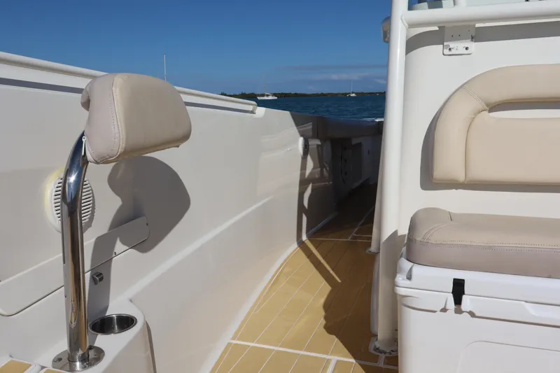  Yacht Photos Pics 2017 Sailfish 320 CC boat interior with beige seating and ocean view.