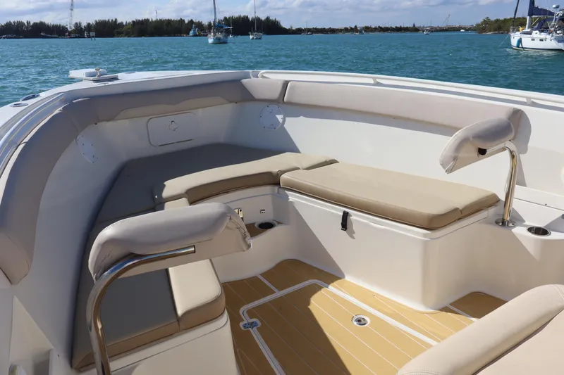  Yacht Photos Pics 2017 Sailfish 320 CC boat interior with cushioned seating and ocean view.