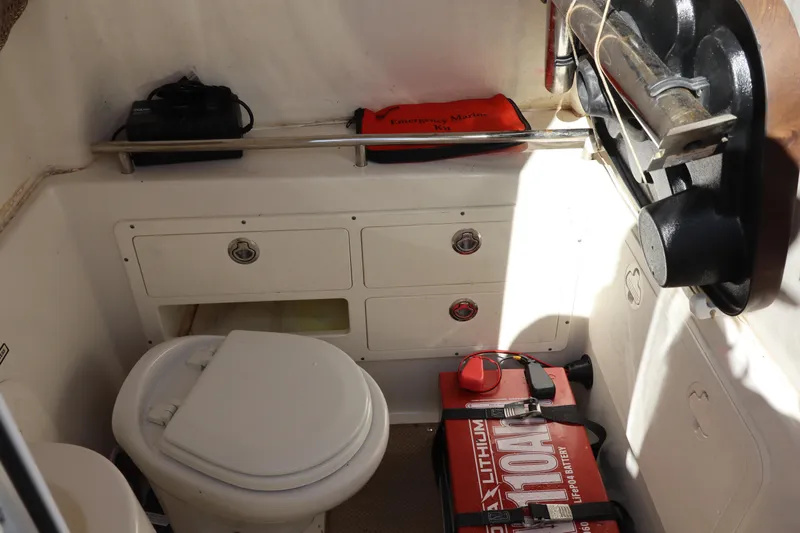  Yacht Photos Pics Interior of 2017 Sailfish 320 CC boat with marine toilet and emergency kit.