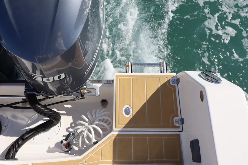  Yacht Photos Pics 2017 Sailfish 320 CC boat with Yamaha 300 engine on water.